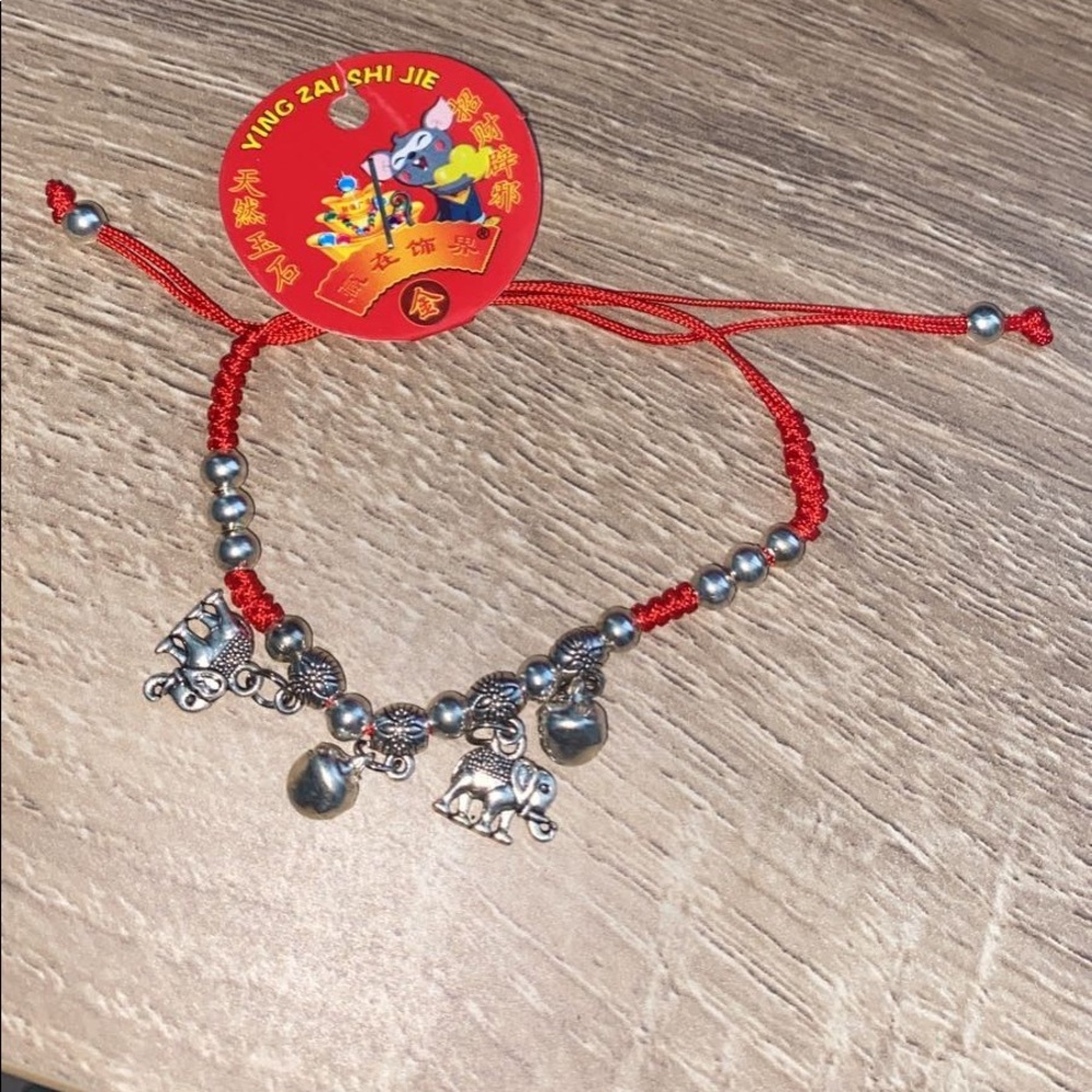 Bracelet red with elephants (os) new.